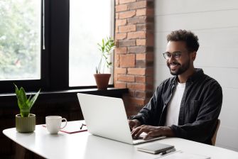 Man working on laptop computer.